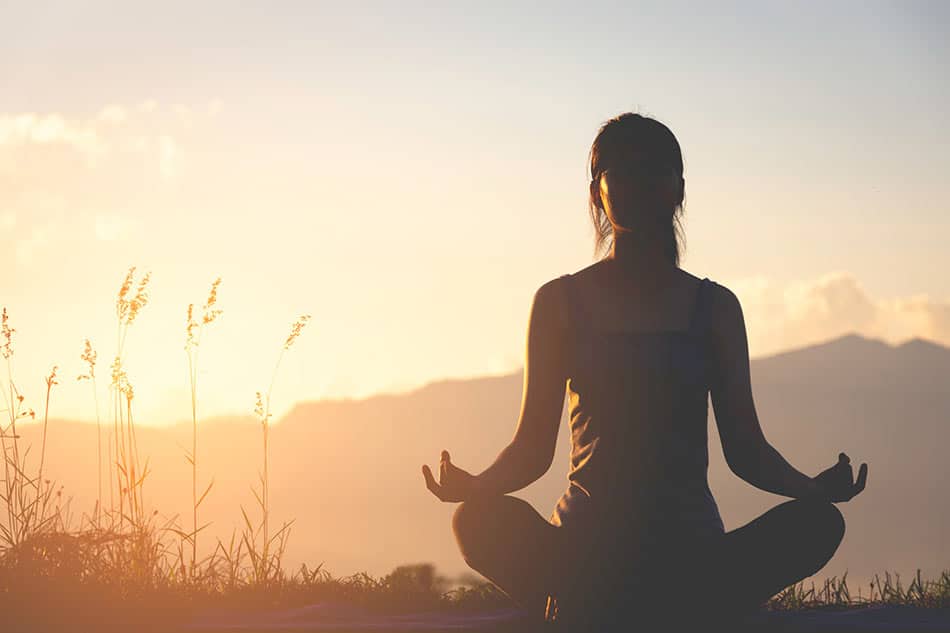 meditation-to-slow-hair-loss Image of woman meditatiing